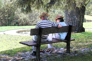 A couple on a park bench