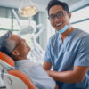 Caring Dentist with patient in office