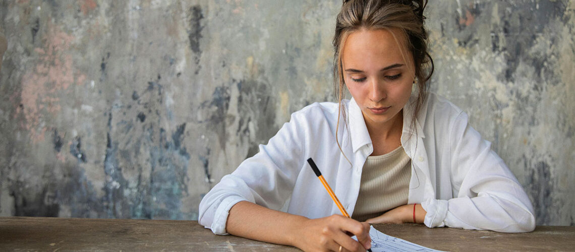 Woman engaging in writing down marketing idea.