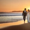 Couple walking on beach in Australia