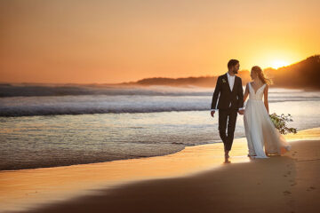 Couple walking on beach in Australia